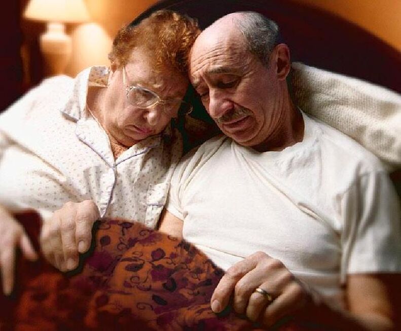elderly couple in bed